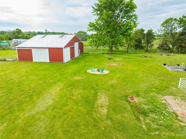 340 Greene Rd, Sparta, MO 65753 - view of yard featuring a pole building, a detached garage, driveway, an outbuilding, and view of scattered trees