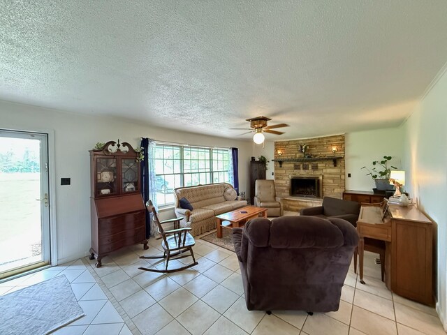 3036 P Hwy, Alton, MO 65606 - living area with a ceiling fan, light tile patterned floors, a fireplace, and a textured ceiling