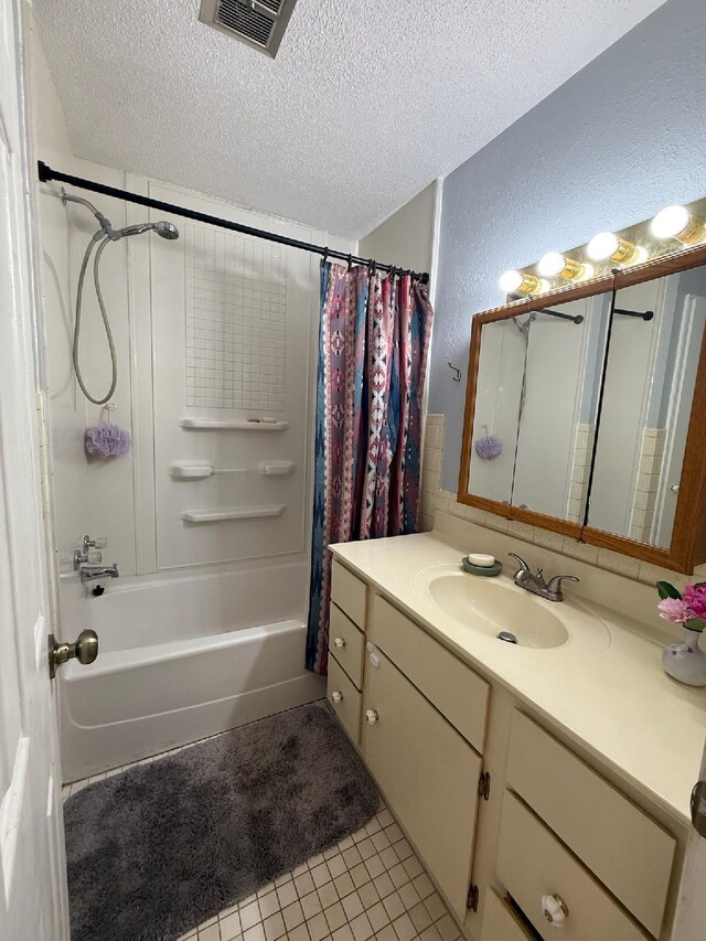 3036 P Hwy, Alton, MO 65606 - full bath with a textured ceiling, vanity, a textured wall, shower / bath combination with curtain, and tile patterned floors
