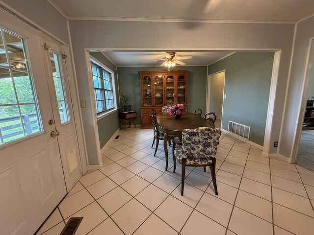 3036 P Hwy, Alton, MO 65606 - dining space with ornamental molding, light tile patterned flooring, a ceiling fan, and baseboards