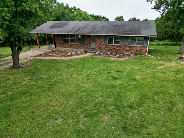 3036 P Hwy, Alton, MO 65606 - ranch-style house with brick siding, a front yard, driveway, and a carport