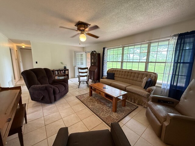 3036 P Hwy, Alton, MO 65606 - living area with light tile patterned flooring, ceiling fan, and a textured ceiling