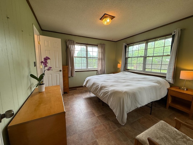 3036 P Hwy, Alton, MO 65606 - bedroom with crown molding, a textured ceiling, and wood walls
