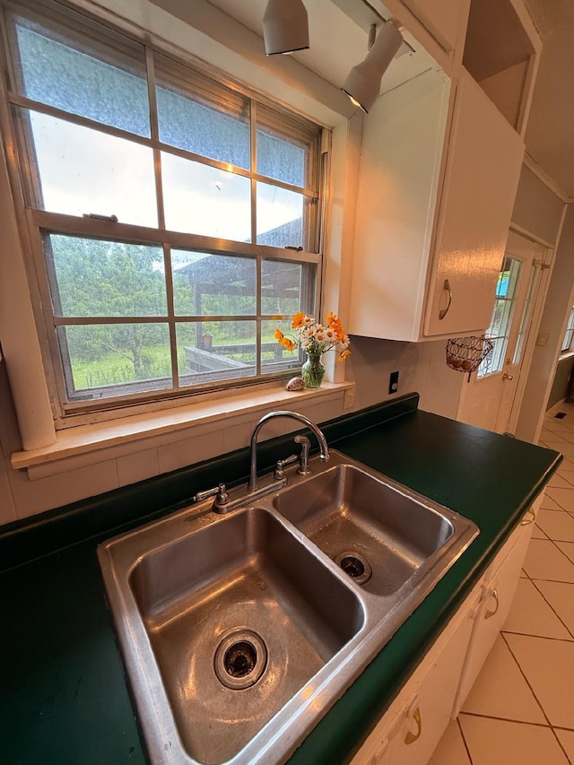 3036 P Hwy, Alton, MO 65606 - kitchen featuring a sink, tile patterned flooring, white cabinetry, and dark countertops