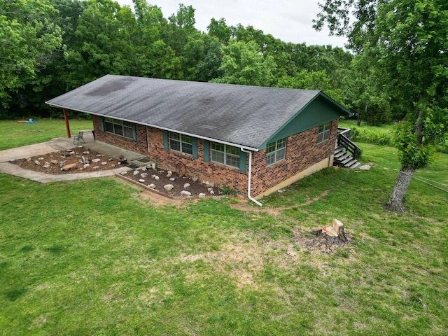 3036 P Hwy, Alton, MO 65606 - view of front facade featuring a front lawn, a patio, roof with shingles, brick siding, and a forest view