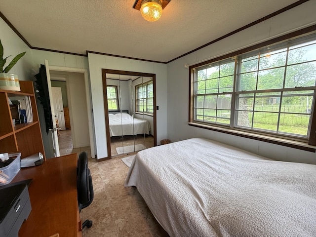 3036 P Hwy, Alton, MO 65606 - bedroom featuring ornamental molding, a textured ceiling, and a closet