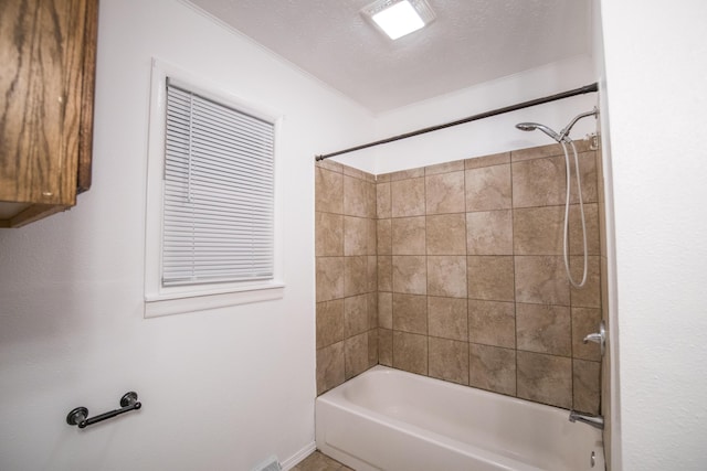 full bathroom with bathtub / shower combination and baseboards