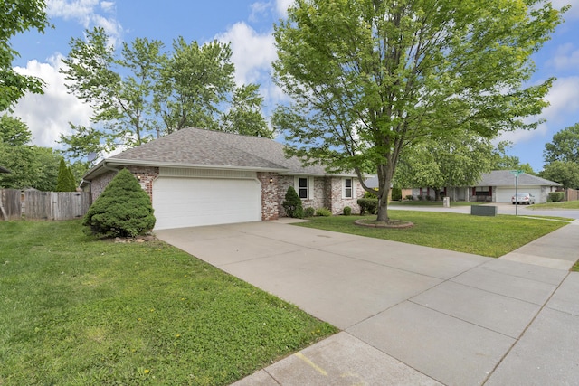 3563 S Western Ave, Springfield, MO 65807 - view of front of home with an attached garage, brick siding, driveway, and a shingled roof
