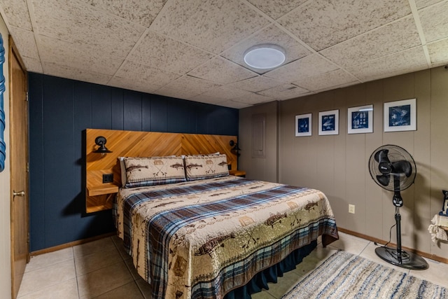 bedroom featuring baseboards and tile patterned flooring
