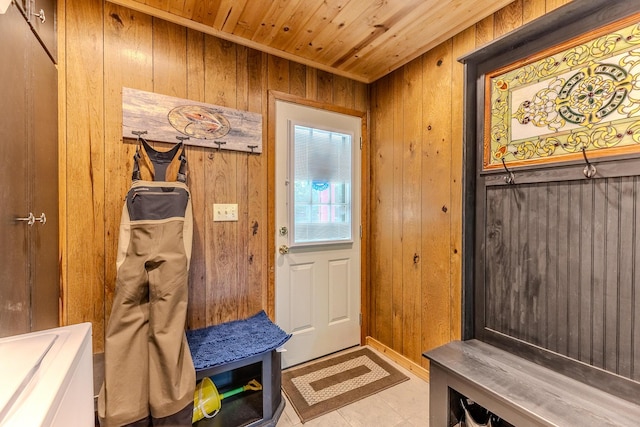 mudroom with wood walls and wood ceiling
