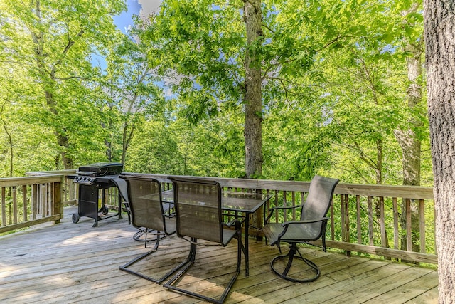 wooden deck with outdoor dining space