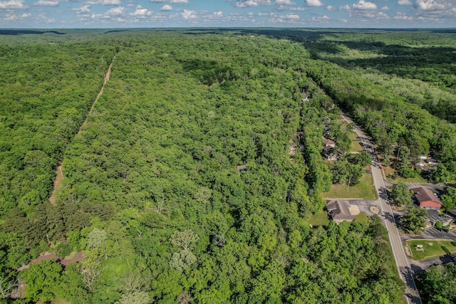 aerial overview of property's location featuring a heavily wooded area
