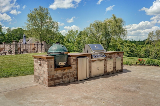 view of patio / terrace featuring exterior kitchen and area for grilling