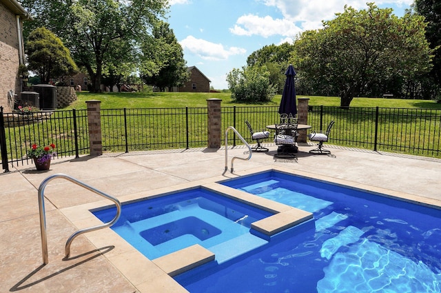 view of swimming pool featuring an in-ground hot tub and a patio