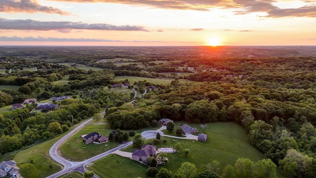 view of property location featuring a heavily wooded area