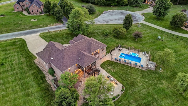 view of subject property with a pool