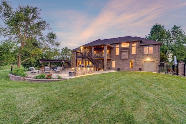 rear view of property with a patio, brick siding, and stairway