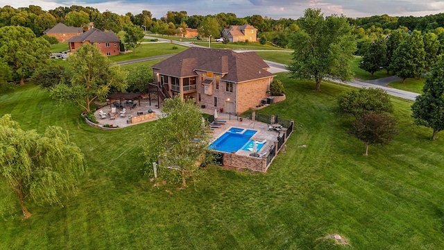 aerial view of property and surrounding area with a pool