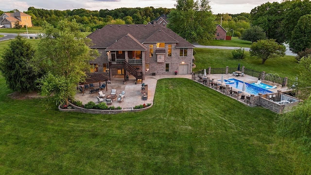 rear view of house with a patio, stairs, a deck, and brick siding