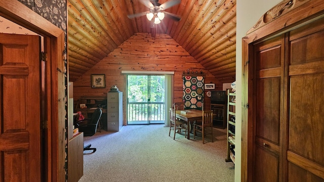 carpeted home office featuring lofted ceiling, wooden ceiling, ceiling fan, and wood walls