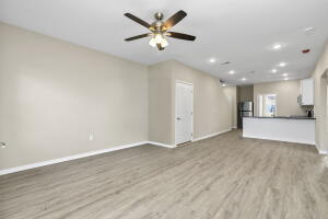 unfurnished living room featuring baseboards, wood finished floors, a ceiling fan, and recessed lighting