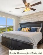 bedroom with wood finished floors and ceiling fan