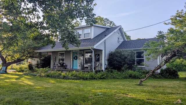 636 W Center St, Rogersville, MO 65742 - view of front facade with roof with shingles, a front yard, and a porch