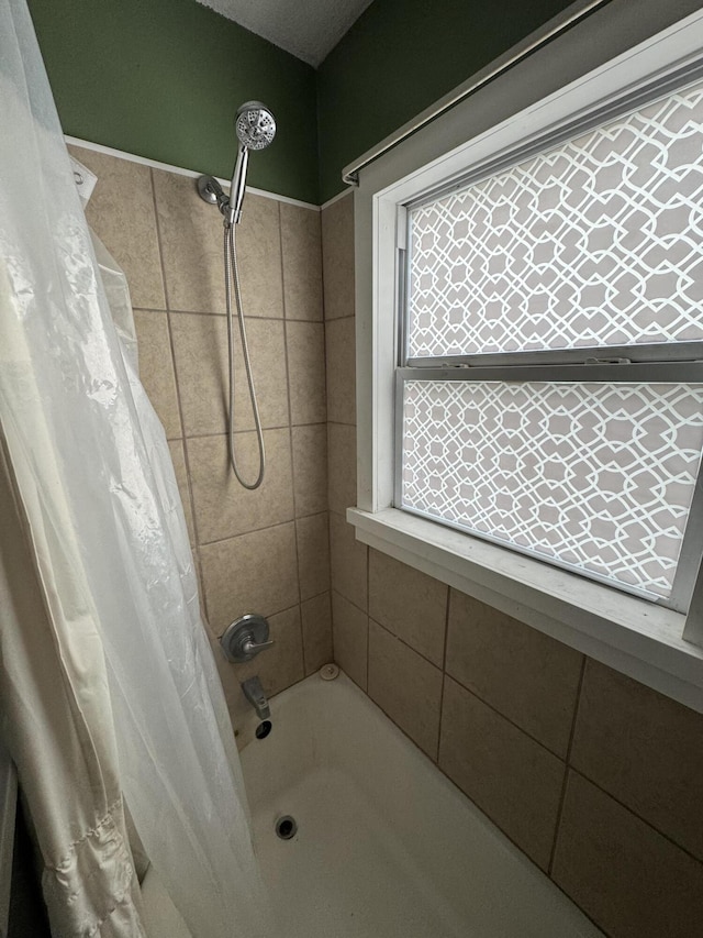 full bath featuring shower / bathtub combination with curtain