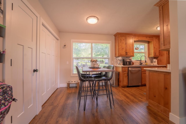 dining area featuring dark wood finished floors and baseboards