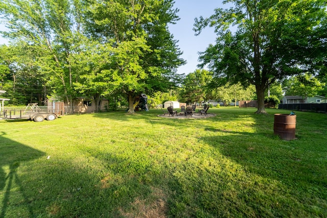 view of yard with a fire pit