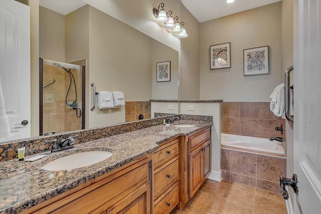 bathroom with a stall shower, a bath, tile patterned flooring, and double vanity