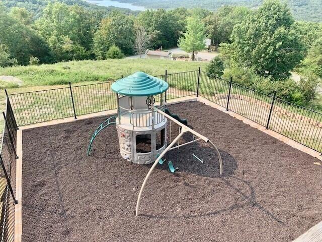 view of jungle gym with fence