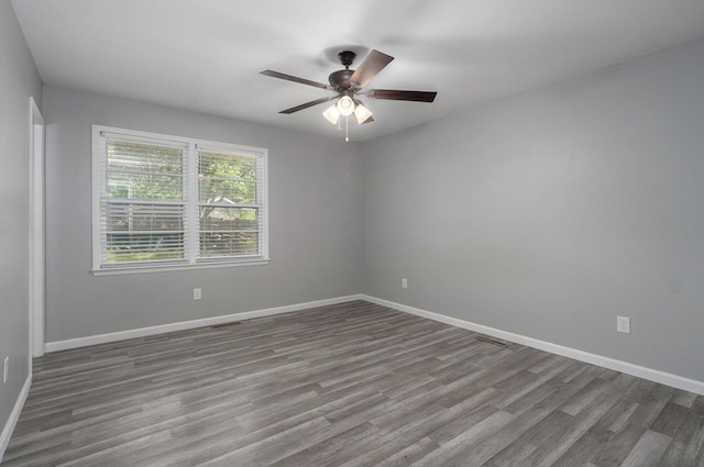 2857 E Linwood St, Springfield, MO 65804 - empty room featuring wood finished floors and baseboards