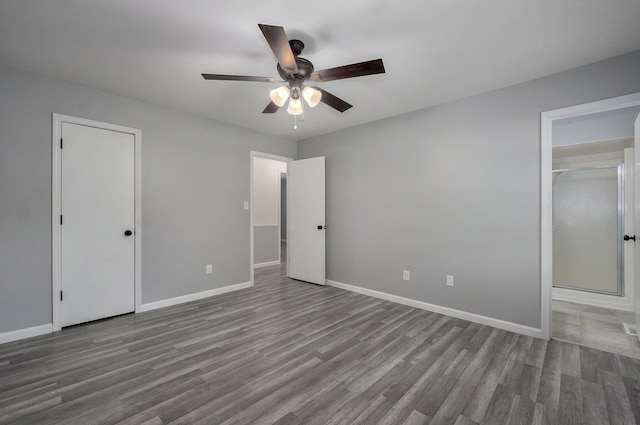 2857 E Linwood St, Springfield, MO 65804 - unfurnished bedroom with wood finished floors, baseboards, ceiling fan, and a closet