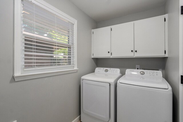 2857 E Linwood St, Springfield, MO 65804 - laundry area with cabinet space, separate washer and dryer, and baseboards