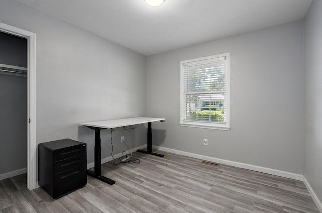 2857 E Linwood St, Springfield, MO 65804 - home office featuring light wood-type flooring and baseboards