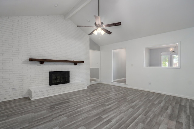 2857 E Linwood St, Springfield, MO 65804 - unfurnished living room featuring a ceiling fan, wood finished floors, a brick fireplace, and baseboards