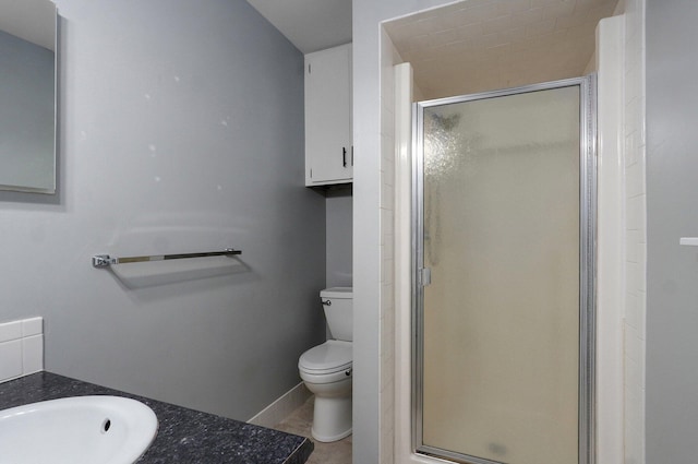 2857 E Linwood St, Springfield, MO 65804 - bathroom featuring a stall shower, toilet, vanity, and baseboards