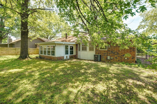 2857 E Linwood St, Springfield, MO 65804 - rear view of house with brick siding and central AC