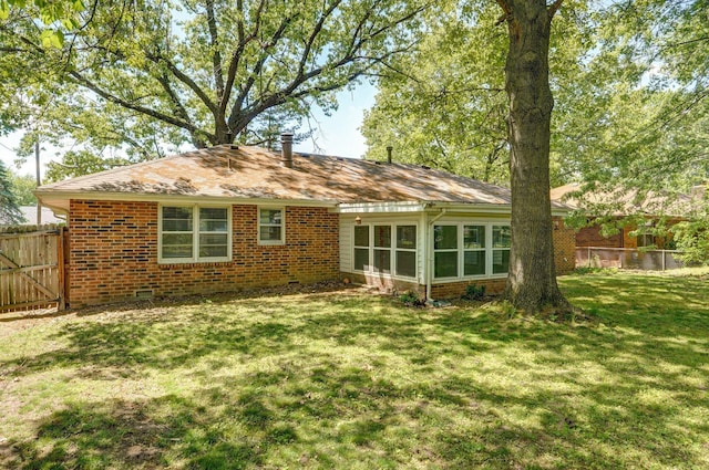 2857 E Linwood St, Springfield, MO 65804 - rear view of property with brick siding, crawl space, and a sunroom