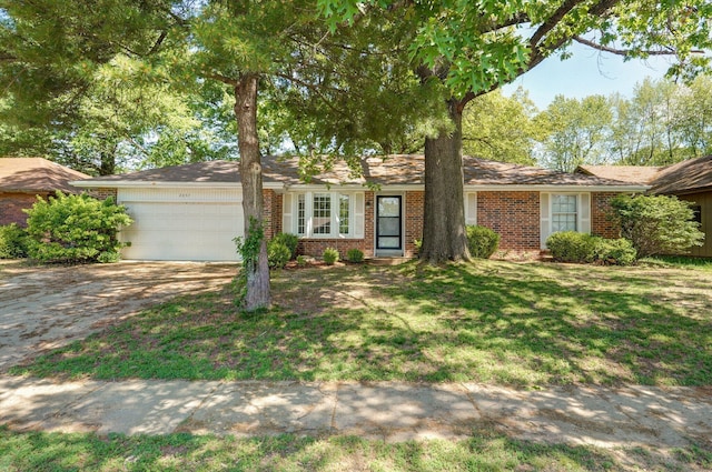 2857 E Linwood St, Springfield, MO 65804 - ranch-style home featuring brick siding, a garage, driveway, and a front lawn