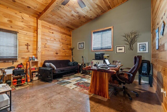 office with vaulted ceiling, wooden walls, wood ceiling, and concrete flooring