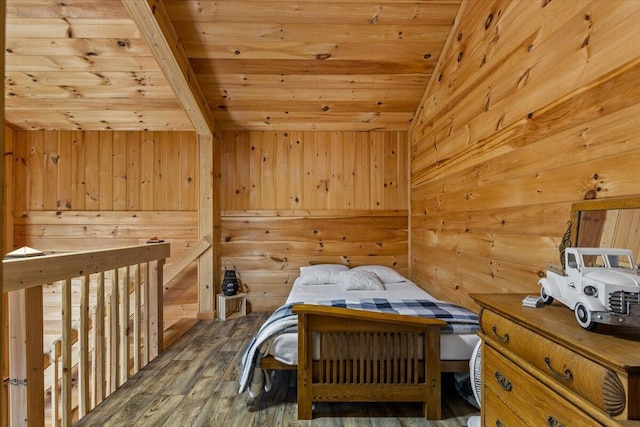 bedroom with wood ceiling, wooden walls, and wood finished floors