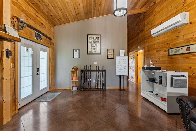 foyer featuring wooden walls, a wall mounted AC, wood ceiling, french doors, and high vaulted ceiling