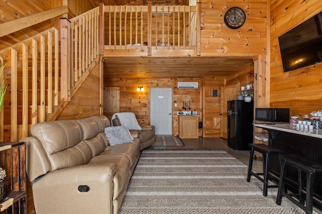 living area with wood walls