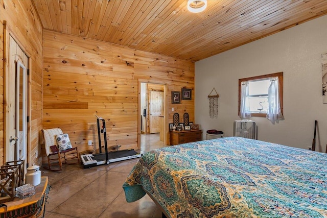 bedroom with wood walls and concrete flooring
