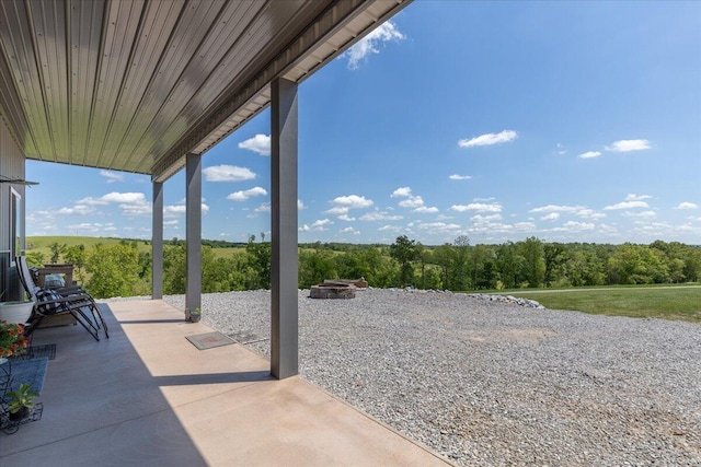 view of patio / terrace featuring a fire pit