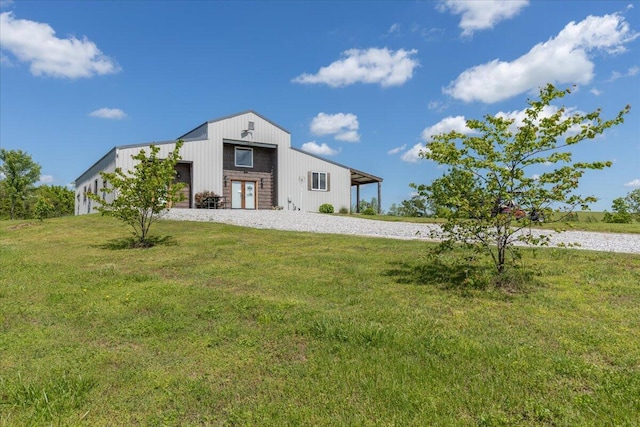 view of front of home with a garage and a front lawn