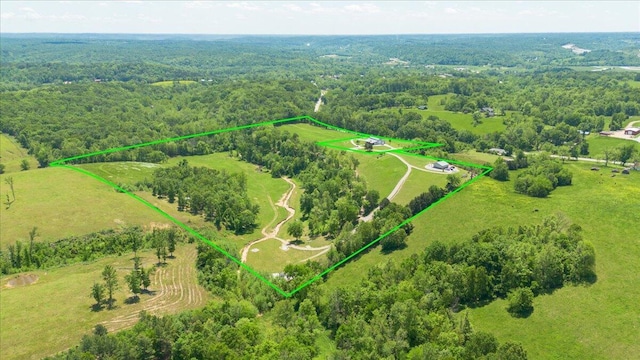 overview of rural landscape with property parcel outlined and a heavily wooded area