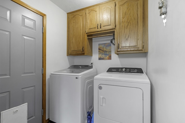 2515 S Laurel Ave, Springfield, MO 65807 - clothes washing area with independent washer and dryer, cabinet space, and a textured ceiling
